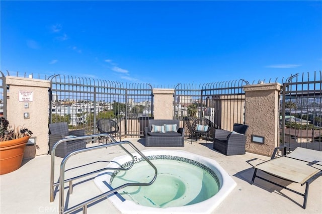 view of swimming pool with a patio, an outdoor hangout area, and a hot tub