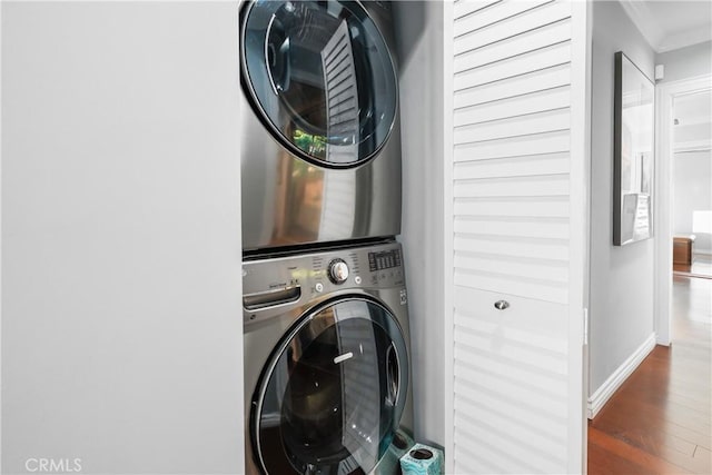 410 Via Mesa Grande, Redondo Beach, CA 90277 - laundry area featuring stacked washer / drying machine, ornamental molding, wood finished floors, and baseboards