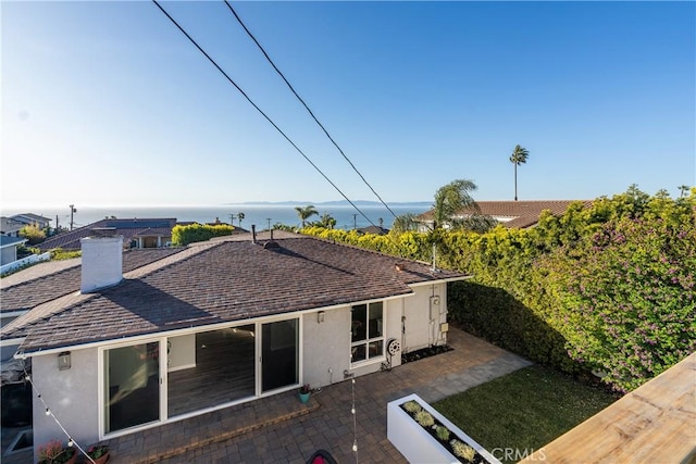 410 Via Mesa Grande, Redondo Beach, CA 90277 - back of house with stucco siding, roof with shingles, a patio, and a chimney