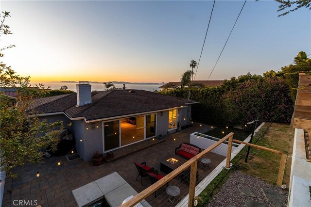 410 Via Mesa Grande, Redondo Beach, CA 90277 - back of property featuring a fire pit, a chimney, a patio, a shingled roof, and stucco siding