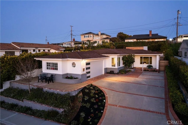 410 Via Mesa Grande, Redondo Beach, CA 90277 - view of front facade featuring driveway, stucco siding, and a garage