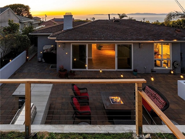 410 Via Mesa Grande, Redondo Beach, CA 90277 - back of property with a patio area, stucco siding, a chimney, and an outdoor fire pit