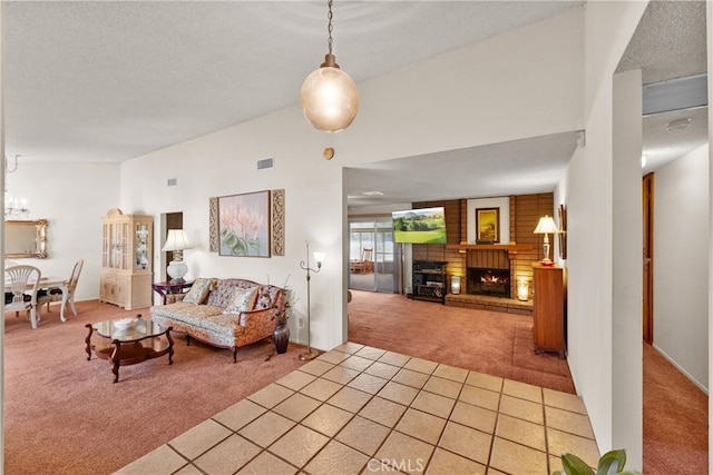 living room with light carpet, a fireplace, a textured ceiling, lofted ceiling, and visible vents