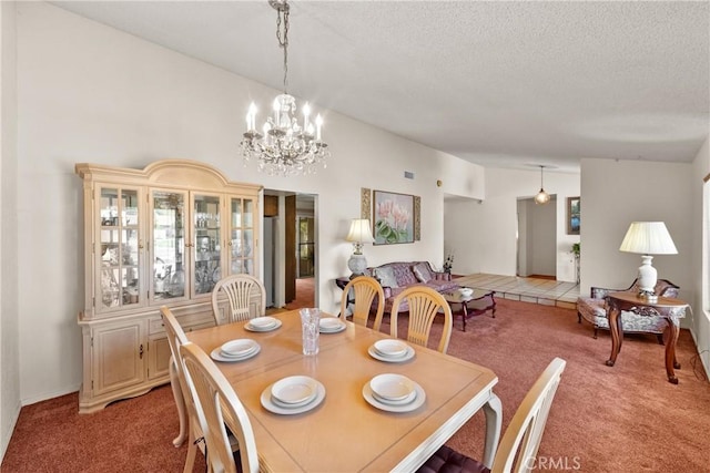 dining room featuring light colored carpet, lofted ceiling, a chandelier, and a textured ceiling