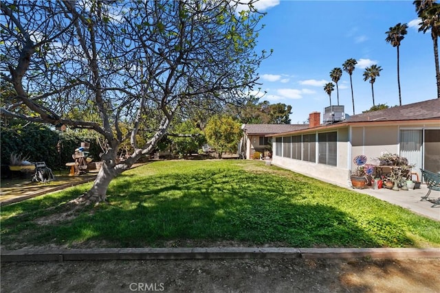 view of yard with a sunroom
