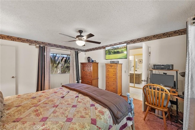 bedroom featuring a ceiling fan, carpet floors, connected bathroom, and a textured ceiling