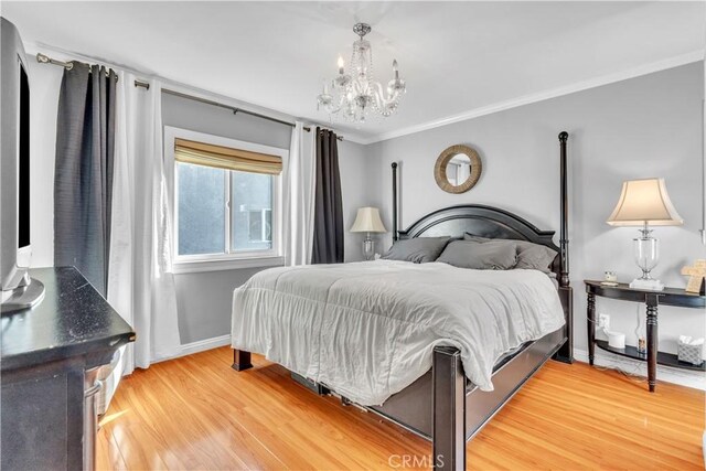 630 King St, Monrovia, CA 91016 - bedroom with a chandelier, light wood-style floors, and crown molding