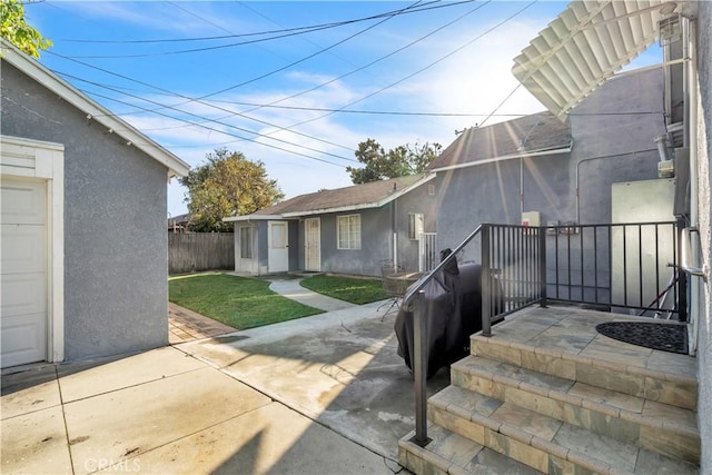 view of patio / terrace featuring fence