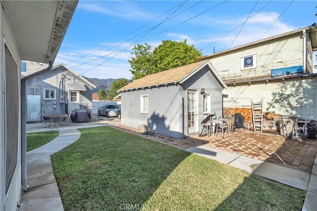 630 King St, Monrovia, CA 91016 - view of green lawn featuring a patio, an outdoor structure, and a mountain view
