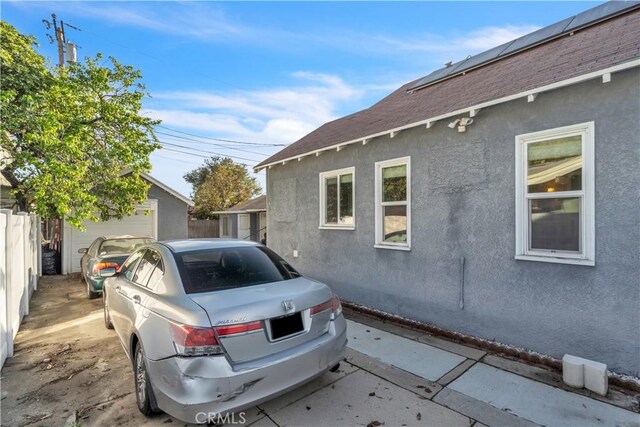 630 King St, Monrovia, CA 91016 - view of home's exterior with stucco siding, an outdoor structure, and roof with shingles