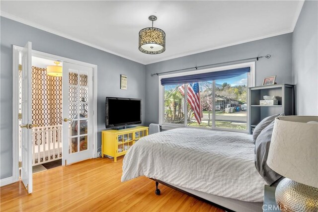 630 King St, Monrovia, CA 91016 - bedroom with crown molding, wood finished floors, and access to outside