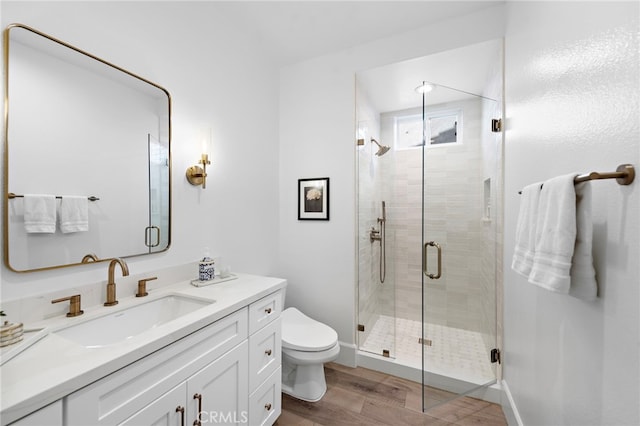 19732 Torres, Lake Forest, CA 92679 - bathroom featuring wood finished floors, toilet, vanity, and a stall shower