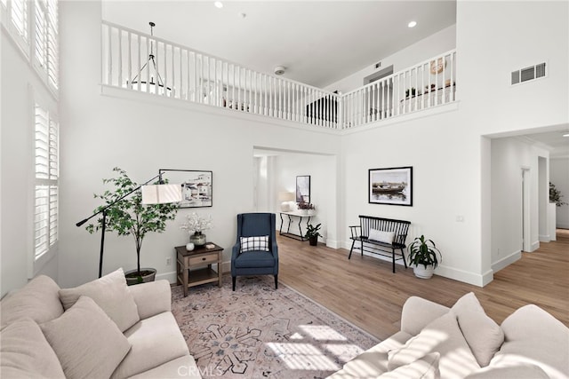 19732 Torres, Lake Forest, CA 92679 - living room featuring a towering ceiling, wood finished floors, baseboards, and recessed lighting