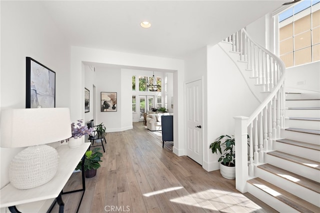 19732 Torres, Lake Forest, CA 92679 - foyer with stairway, recessed lighting, wood-type flooring, and a chandelier
