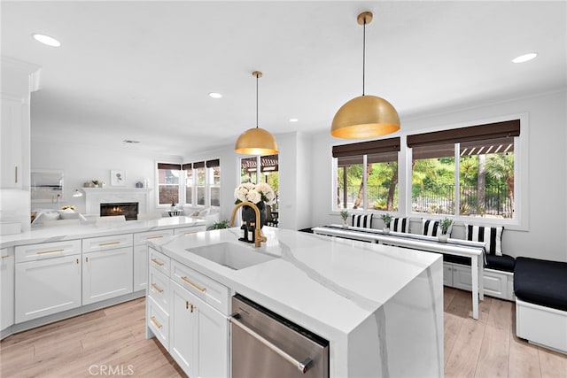 19732 Torres, Lake Forest, CA 92679 - kitchen featuring a sink, dishwasher, open floor plan, recessed lighting, and a warm lit fireplace