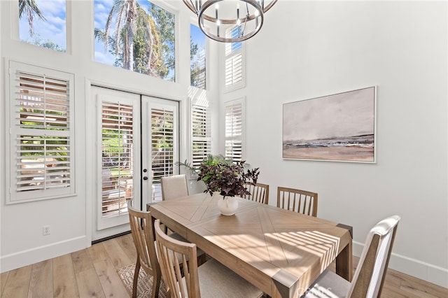 19732 Torres, Lake Forest, CA 92679 - dining room featuring baseboards, healthy amount of natural light, a chandelier, and a high ceiling