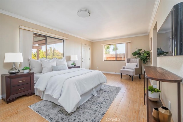 bedroom with light wood-type flooring, baseboards, and crown molding