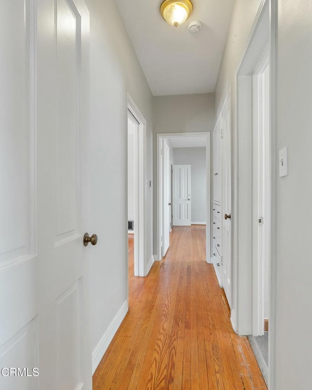646 Orange Grove Ave, South Pasadena, CA 91030 - corridor featuring baseboards and light wood finished floors