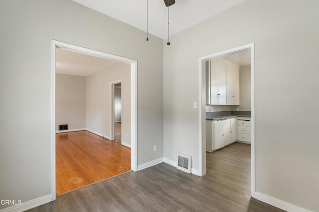646 Orange Grove Ave, South Pasadena, CA 91030 - unfurnished dining area with dark wood finished floors, baseboards, ceiling fan, and visible vents