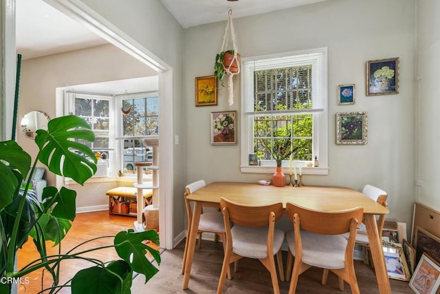 646 Orange Grove Ave, South Pasadena, CA 91030 - dining space with wood finished floors, baseboards, and a wealth of natural light
