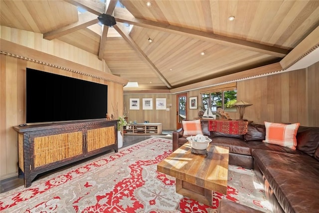 2431 Sherwood Dr, Cambria, CA 93428 - living area with lofted ceiling with beams, wooden walls, wooden ceiling, and ceiling fan