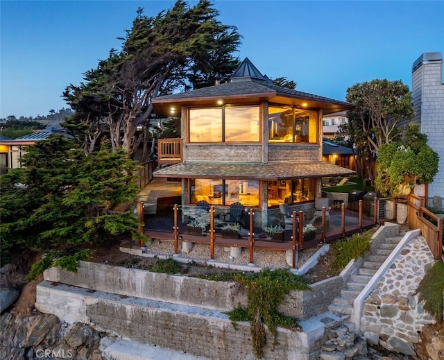 2431 Sherwood Dr, Cambria, CA 93428 - back of property with a shingled roof and stairs