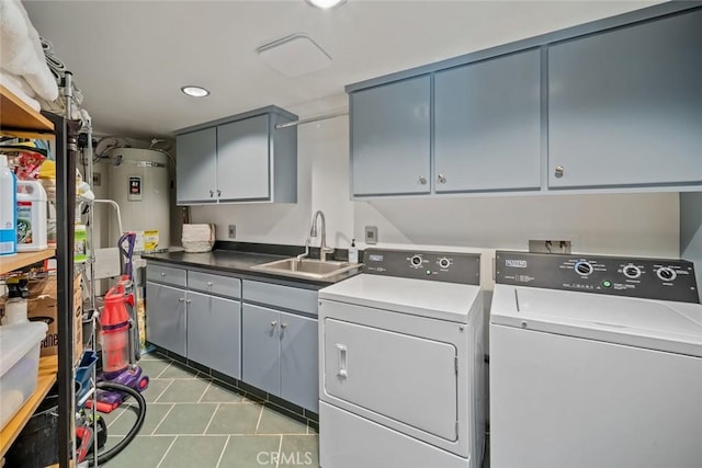 2431 Sherwood Dr, Cambria, CA 93428 - laundry area with tile patterned flooring, water heater, separate washer and dryer, a sink, and cabinet space