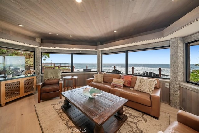 2431 Sherwood Dr, Cambria, CA 93428 - living room featuring light wood-style flooring, wood ceiling, a water view, and recessed lighting