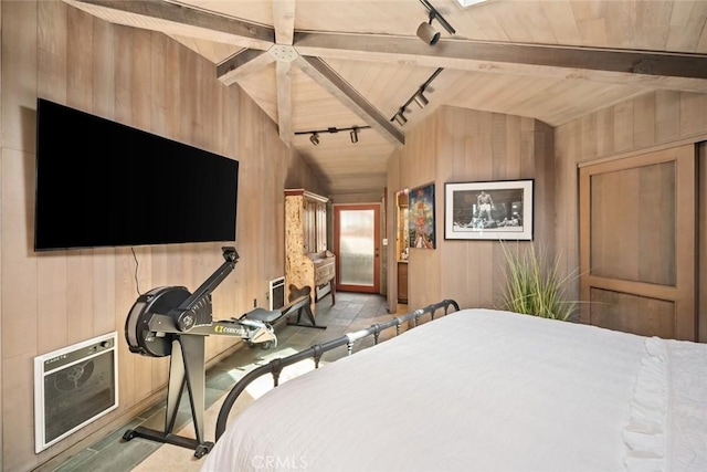 2431 Sherwood Dr, Cambria, CA 93428 - bedroom with lofted ceiling with beams, wooden walls, wooden ceiling, and track lighting