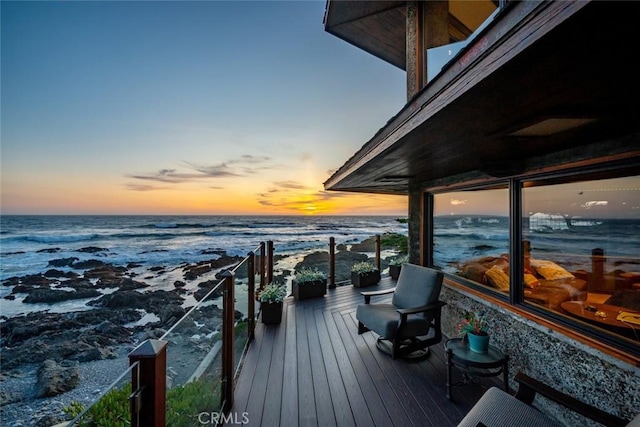2431 Sherwood Dr, Cambria, CA 93428 - deck at dusk featuring a water view and a beach view