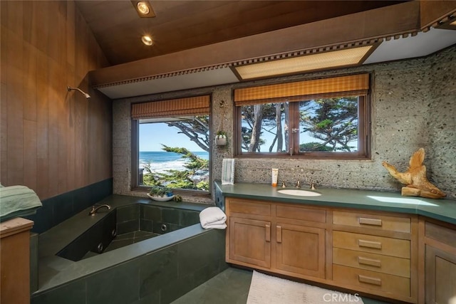 2431 Sherwood Dr, Cambria, CA 93428 - full bathroom featuring vanity, a jetted tub, and tasteful backsplash