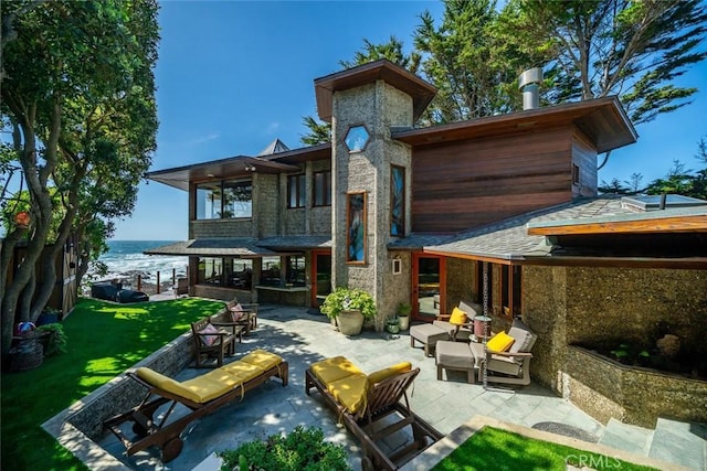 2431 Sherwood Dr, Cambria, CA 93428 - back of house featuring outdoor lounge area, a lawn, a water view, and a patio