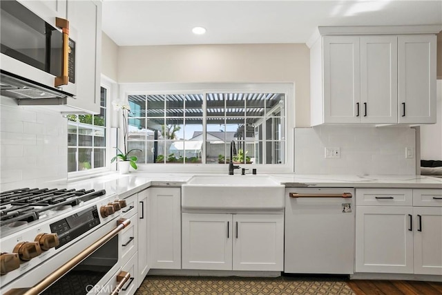 26211 Avenida Deseo, Mission Viejo, CA 92691 - kitchen with stainless steel appliances, white cabinets, tasteful backsplash, light stone counters, and recessed lighting