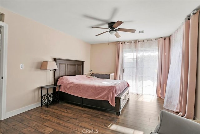 26211 Avenida Deseo, Mission Viejo, CA 92691 - bedroom with dark wood-style flooring, ceiling fan, and radiator heating unit