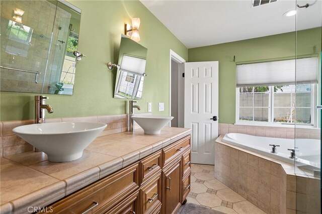 26211 Avenida Deseo, Mission Viejo, CA 92691 - bathroom with a bath, a stall shower, tile patterned flooring, and double vanity