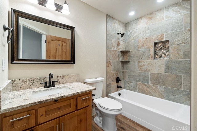 43179 E Sugar Pine Dr, Oakhurst, CA 93644 - full bath featuring toilet, wood finished floors, vanity, and washtub / shower combination