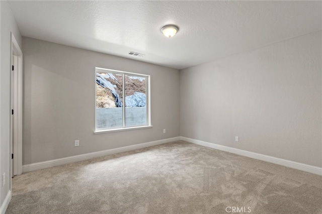 43179 E Sugar Pine Dr, Oakhurst, CA 93644 - empty room featuring baseboards, carpet flooring, a textured ceiling, and visible vents