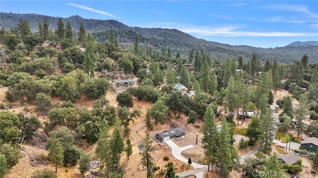 43179 E Sugar Pine Dr, Oakhurst, CA 93644 - aerial view featuring a wooded view and a mountain view