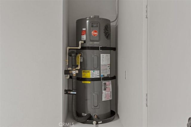 utility room with strapped water heater