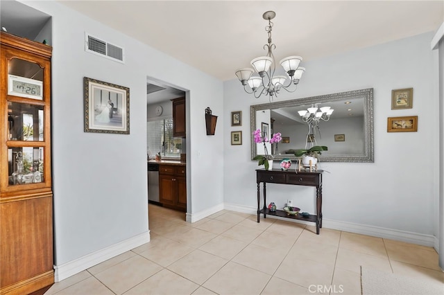 18815 Thornwood Cir Unit Ci32, Huntington Beach, CA 92646 - corridor with baseboards, light tile patterned flooring, a notable chandelier, and visible vents
