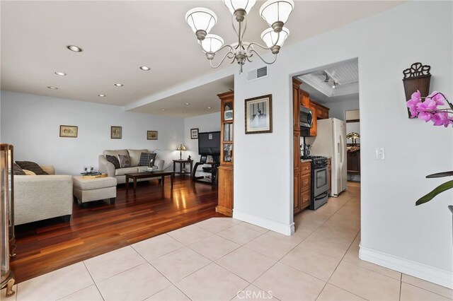 18815 Thornwood Cir Unit Ci32, Huntington Beach, CA 92646 - interior space with visible vents, baseboards, light tile patterned floors, a notable chandelier, and recessed lighting
