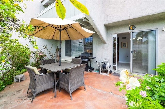 18815 Thornwood Cir Unit Ci32, Huntington Beach, CA 92646 - view of patio featuring outdoor dining space and a grill