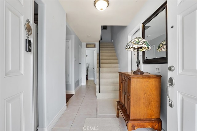 18815 Thornwood Cir Unit Ci32, Huntington Beach, CA 92646 - hallway featuring visible vents, baseboards, stairway, and light tile patterned floors