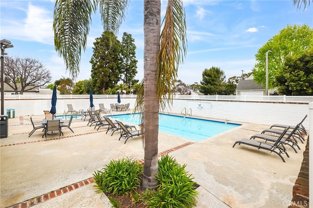 18815 Thornwood Cir Unit Ci32, Huntington Beach, CA 92646 - community pool featuring a patio area and fence
