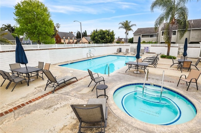 18815 Thornwood Cir Unit Ci32, Huntington Beach, CA 92646 - pool featuring a residential view, a hot tub, a patio, and fence