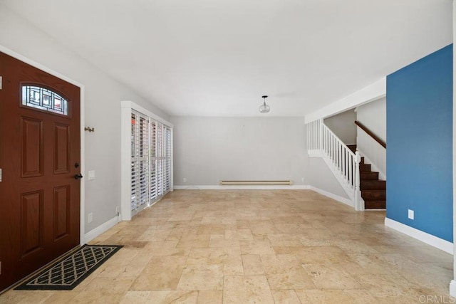 foyer featuring stone finish floor, a baseboard radiator, and baseboards
