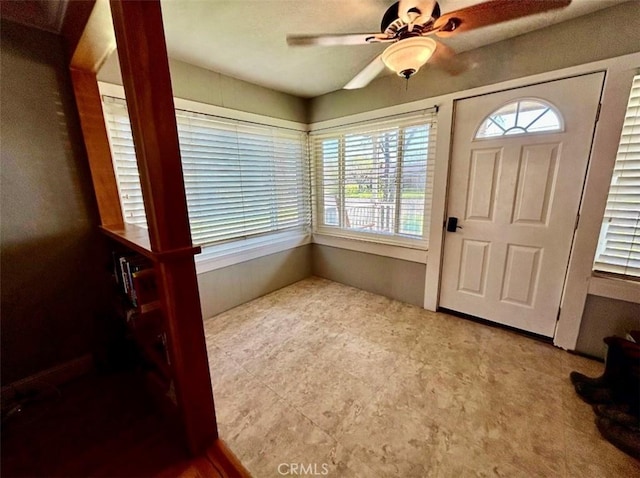 foyer entrance featuring plenty of natural light and a ceiling fan