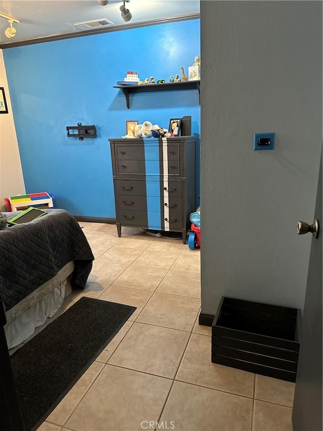 bedroom featuring visible vents and light tile patterned floors