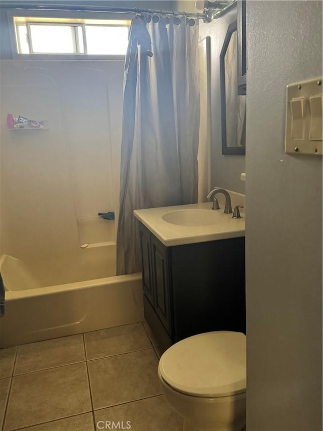 bathroom with tile patterned floors, shower / tub combo with curtain, vanity, and toilet