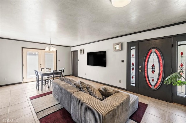 5956 York Glen Way, Sacramento, CA 95842 - living room featuring tile patterned floors, crown molding, a chandelier, baseboards, and plenty of natural light